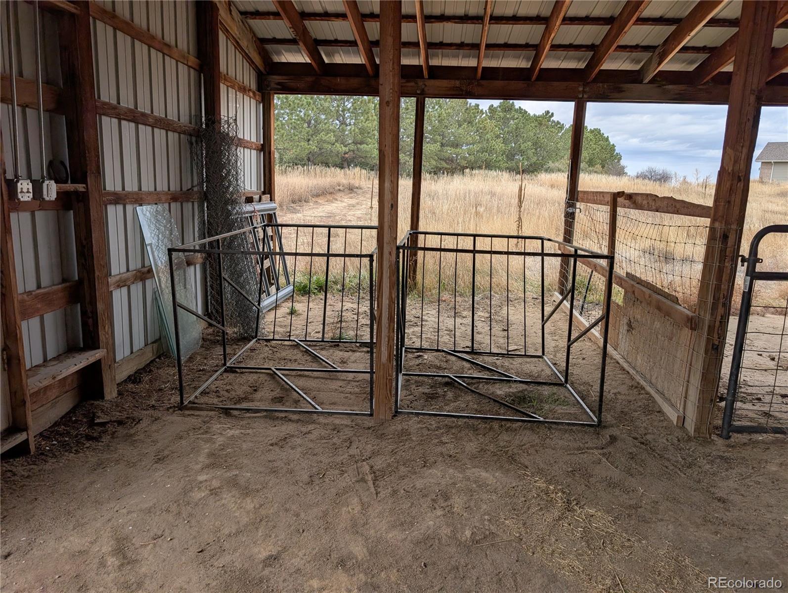 43882 Buckskin Road Parker, CO 80138 - Photo 15 of 19 an empty room with wooden floor and windows