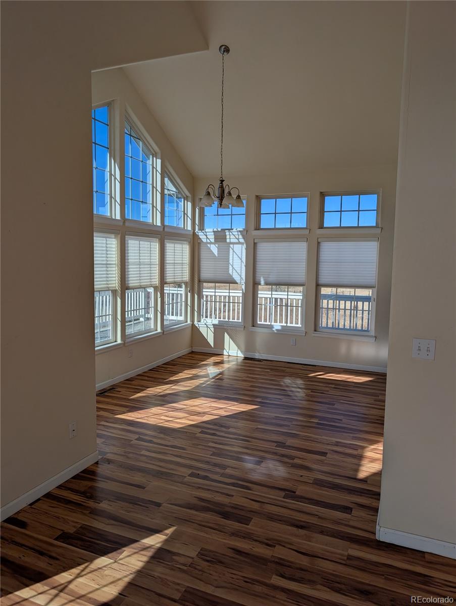 43882 Buckskin Road Parker, CO 80138 - Photo 4 of 19 a view of an empty room with glass door