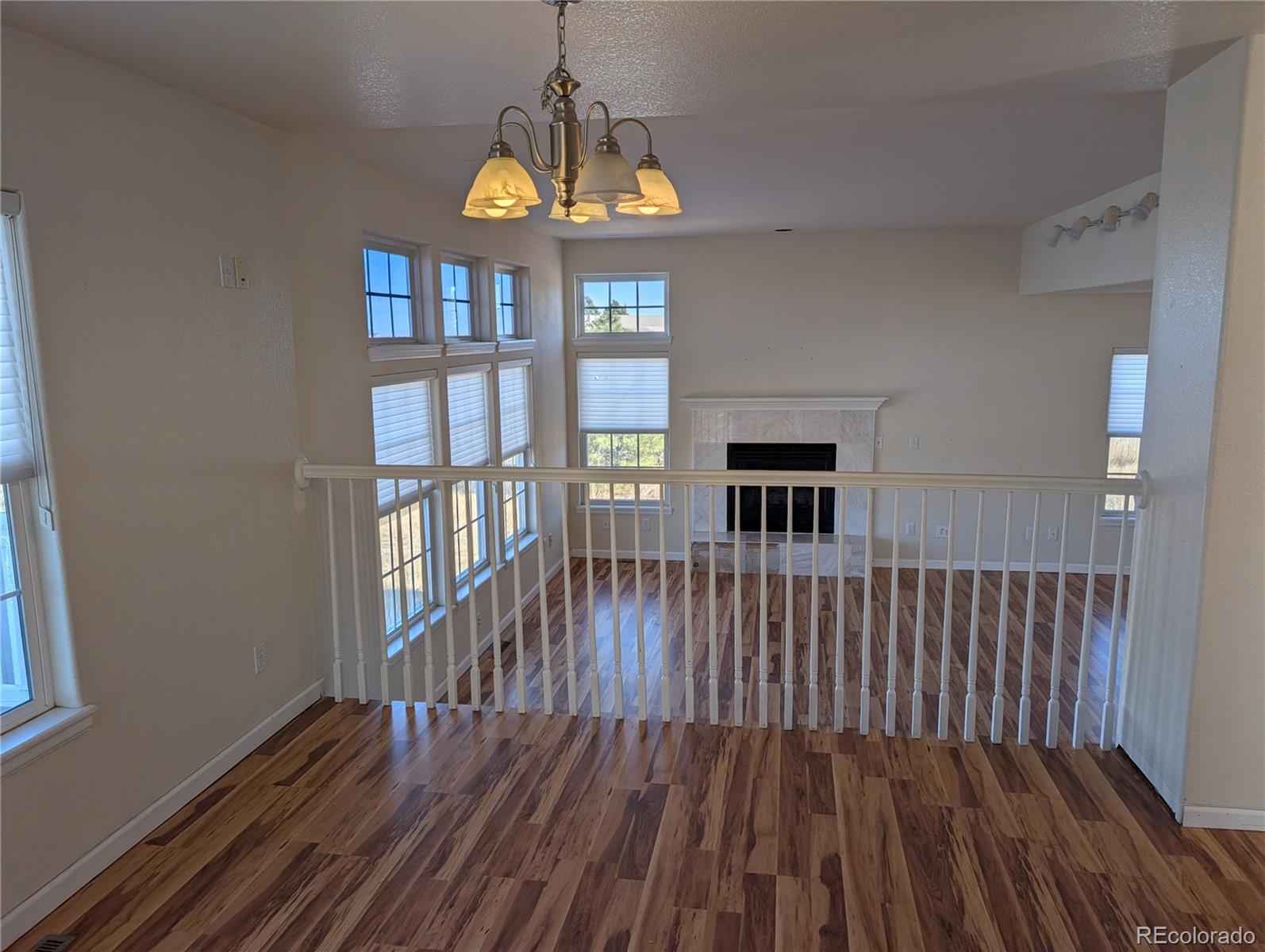 43882 Buckskin Road Parker, CO 80138 - Photo 9 of 19 a view of entryway with wooden floor