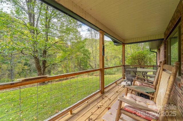a view of balcony with wooden floor