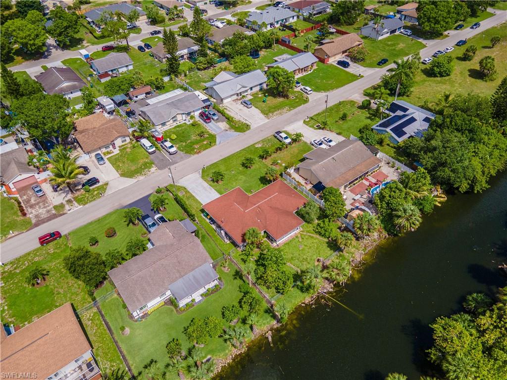 2100 55th Street Southwest Naples, FL 34116 - Photo 14 of 50 an aerial view of a house with a lake view