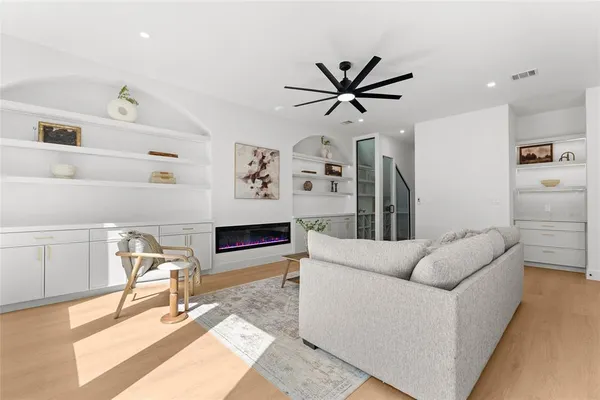 a living room with furniture and a rug