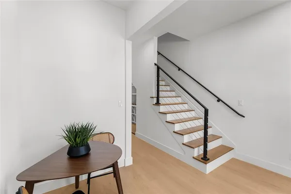 a view of entryway with wooden floor
