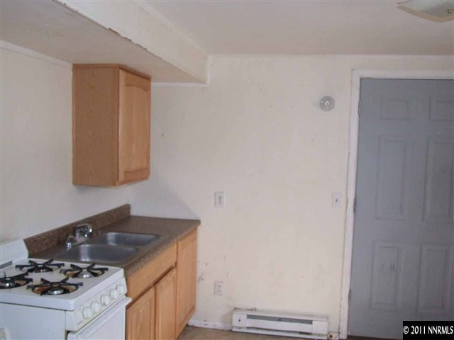 805 Roberts Street Reno, NV 89502 - Photo 8 of 9 a kitchen with a stove and a sink