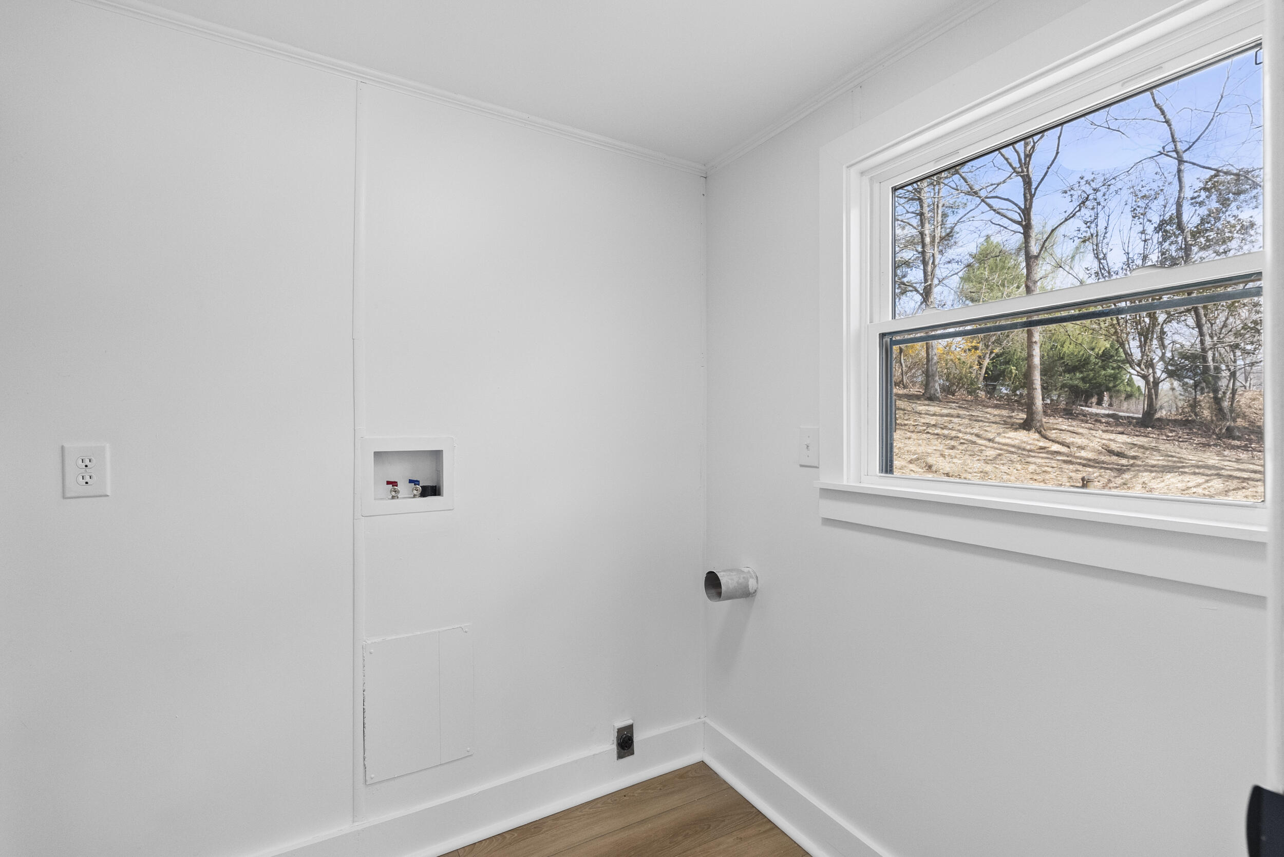 509 Pleasure Point Drive Goodview, VA 24095 - Photo 13 of 38 a view of small space with wooden floor and a window