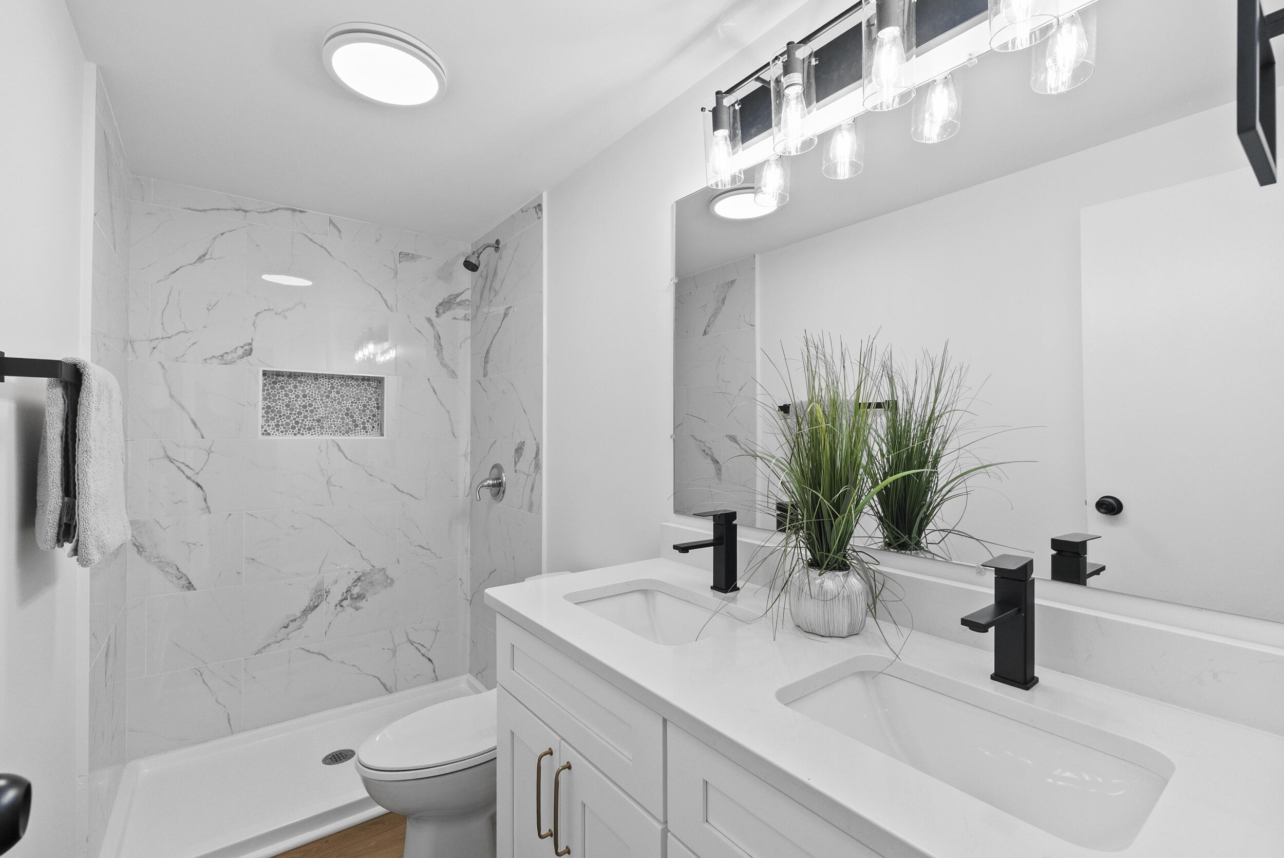 509 Pleasure Point Drive Goodview, VA 24095 - Photo 15 of 38 a bathroom with a granite countertop sink a toilet a mirror and shower