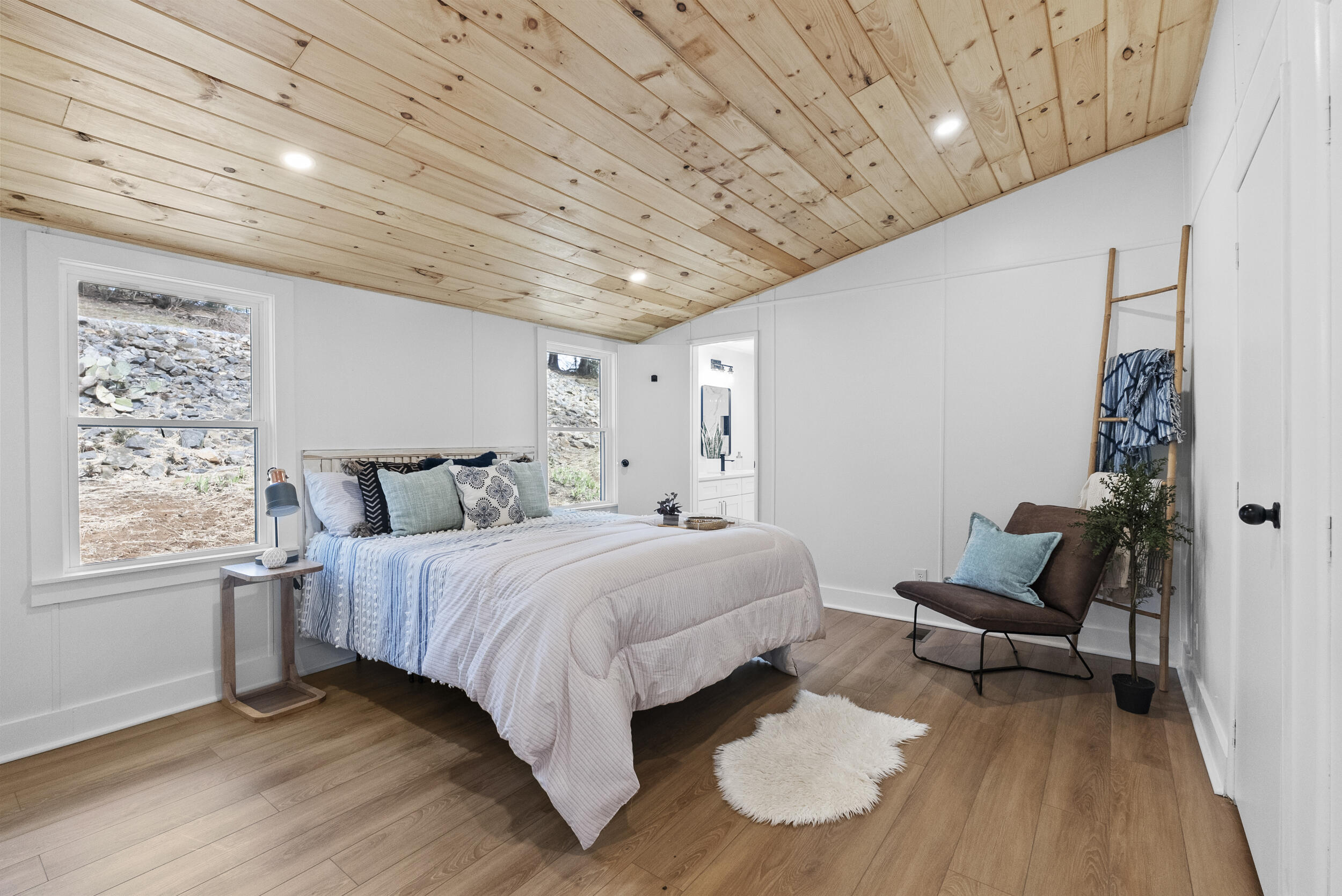 509 Pleasure Point Drive Goodview, VA 24095 - Photo 18 of 38 a bedroom with a bed and a chair