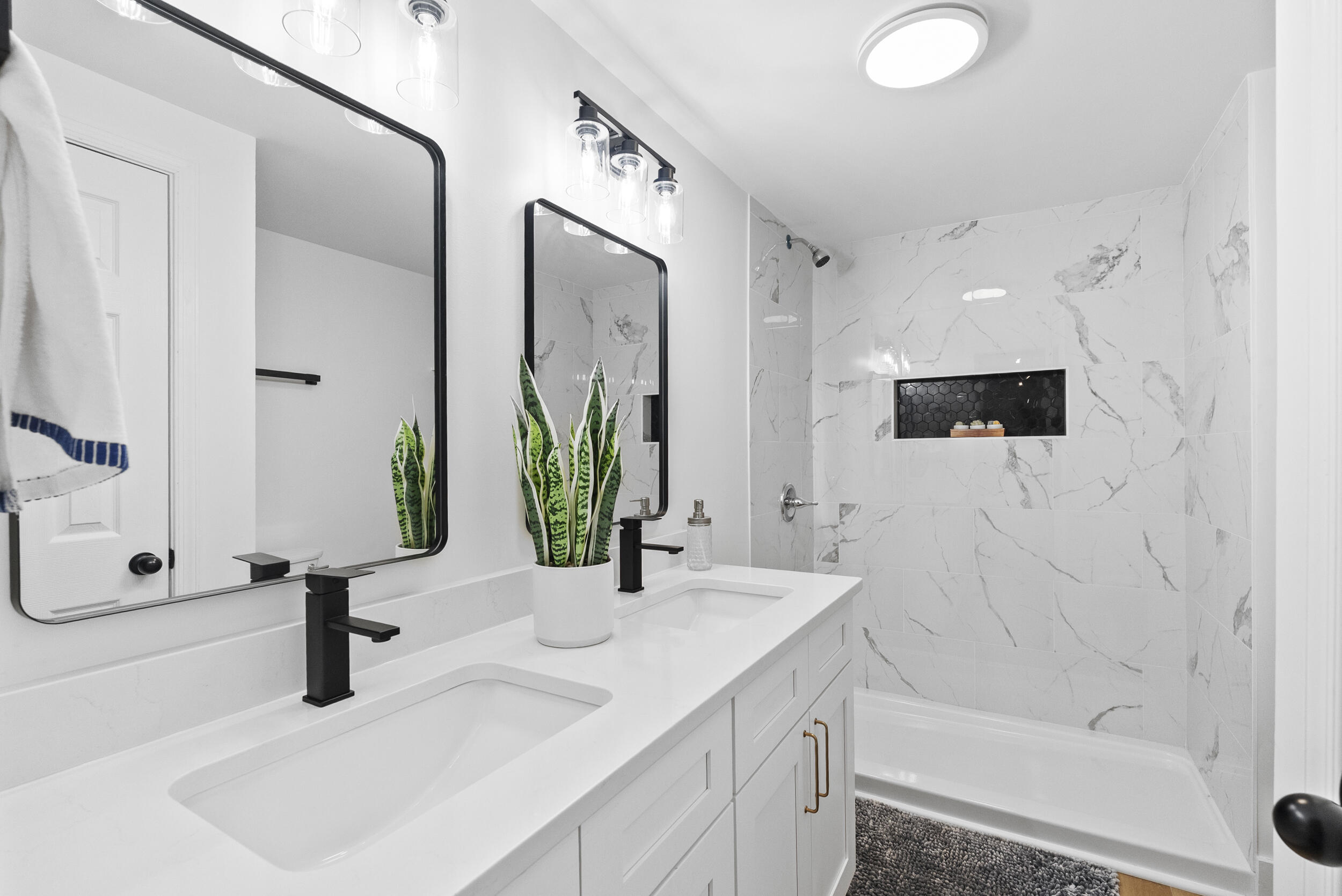 509 Pleasure Point Drive Goodview, VA 24095 - Photo 20 of 38 a bathroom with double vanity sink and a mirror