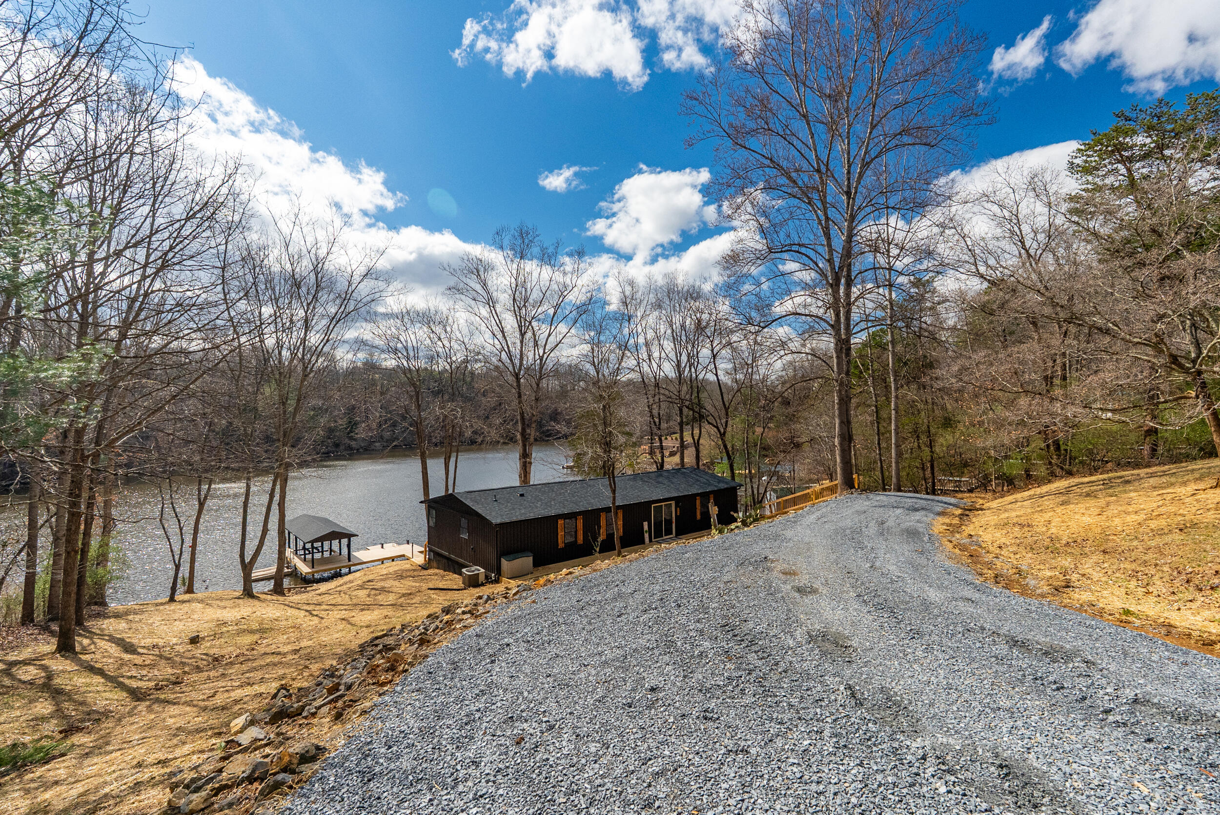 509 Pleasure Point Drive Goodview, VA 24095 - Photo 23 of 38 a view of a backyard with snow on the road