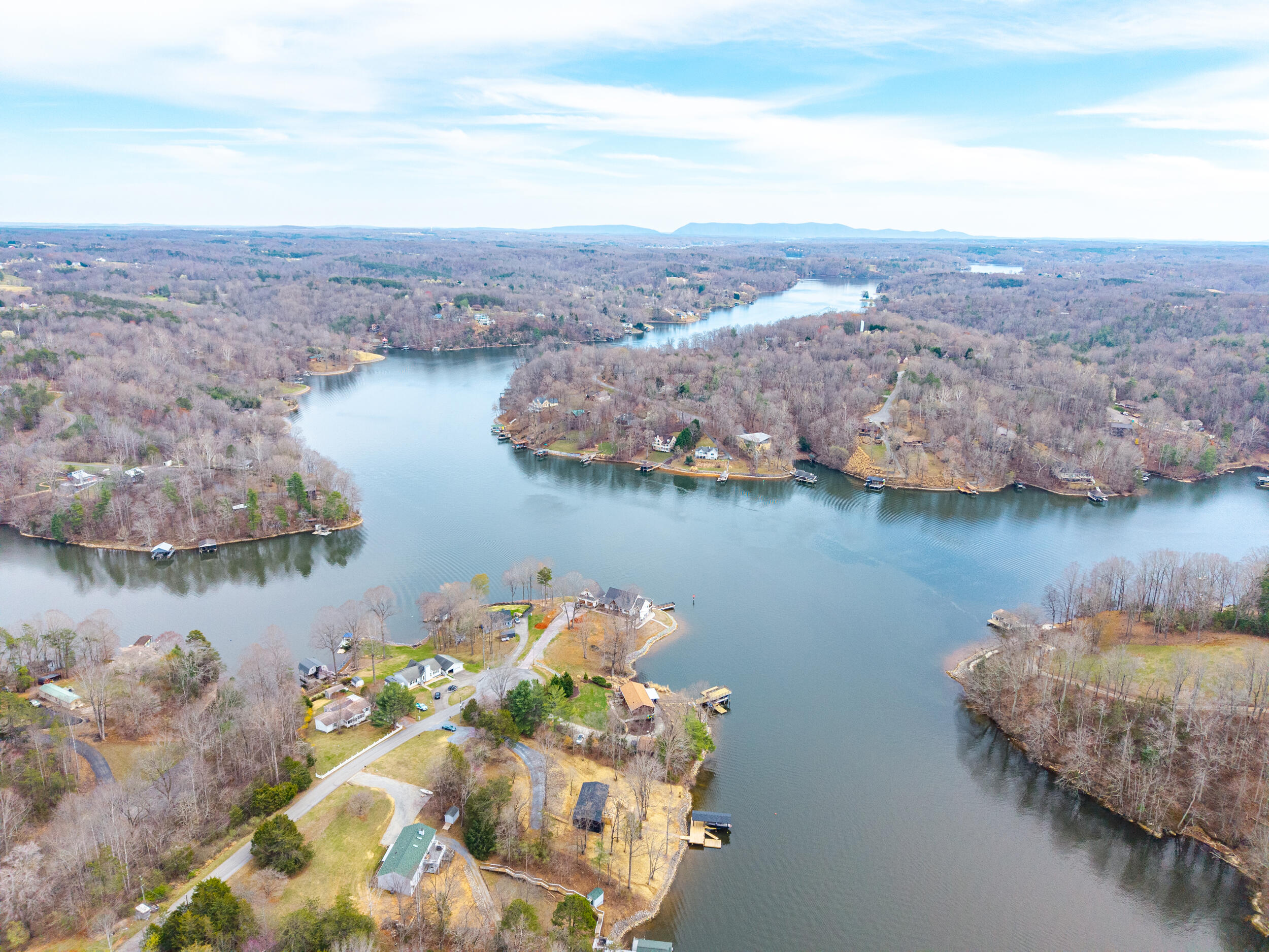 509 Pleasure Point Drive Goodview, VA 24095 - Photo 33 of 38 a view of a lake with a mountain in the background