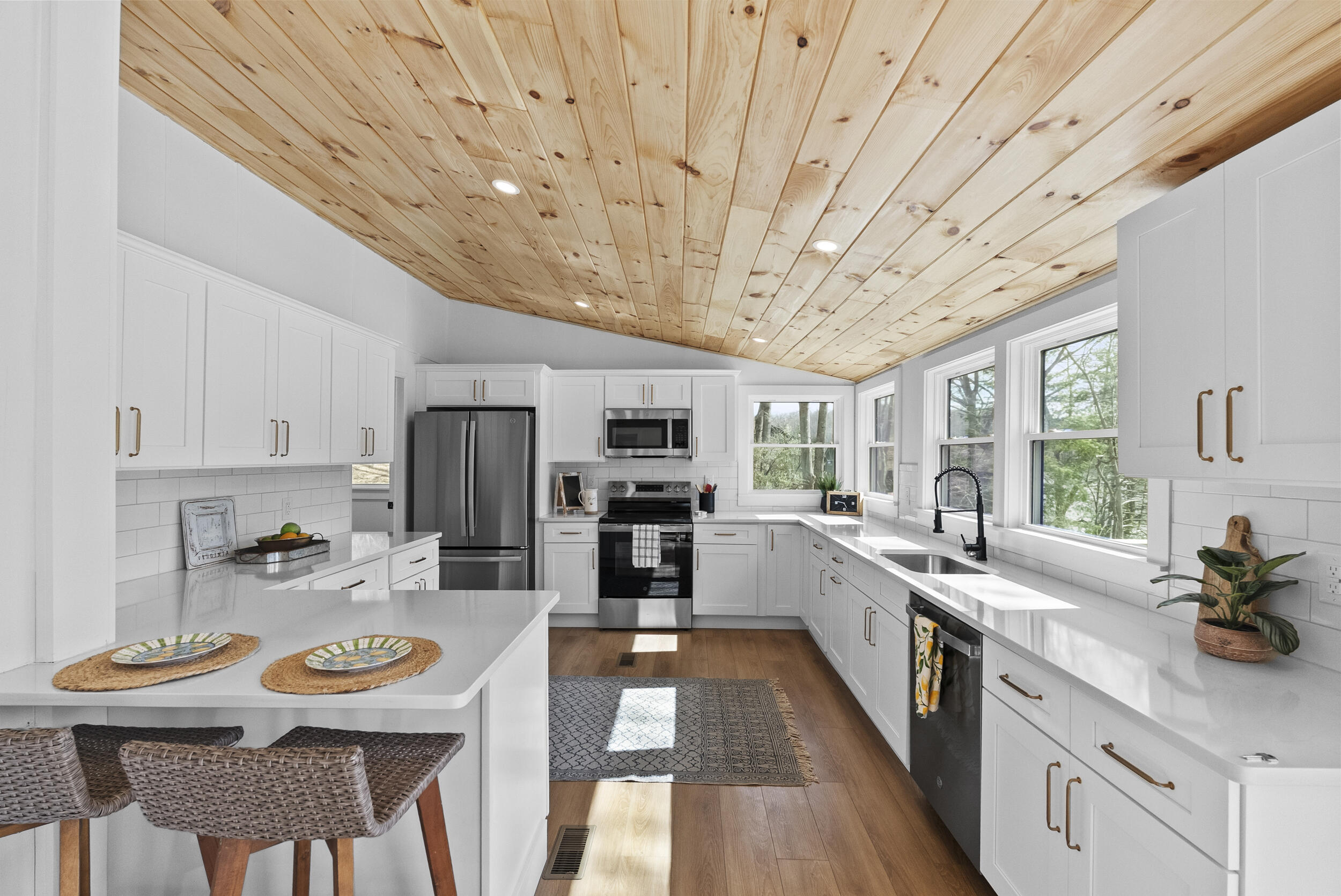 509 Pleasure Point Drive Goodview, VA 24095 - Photo 10 of 38 a kitchen with stainless steel appliances kitchen island granite countertop a sink and cabinets