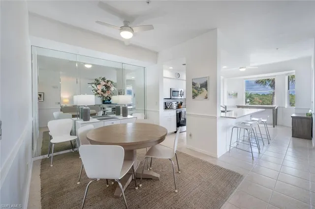 a kitchen with a table and chairs