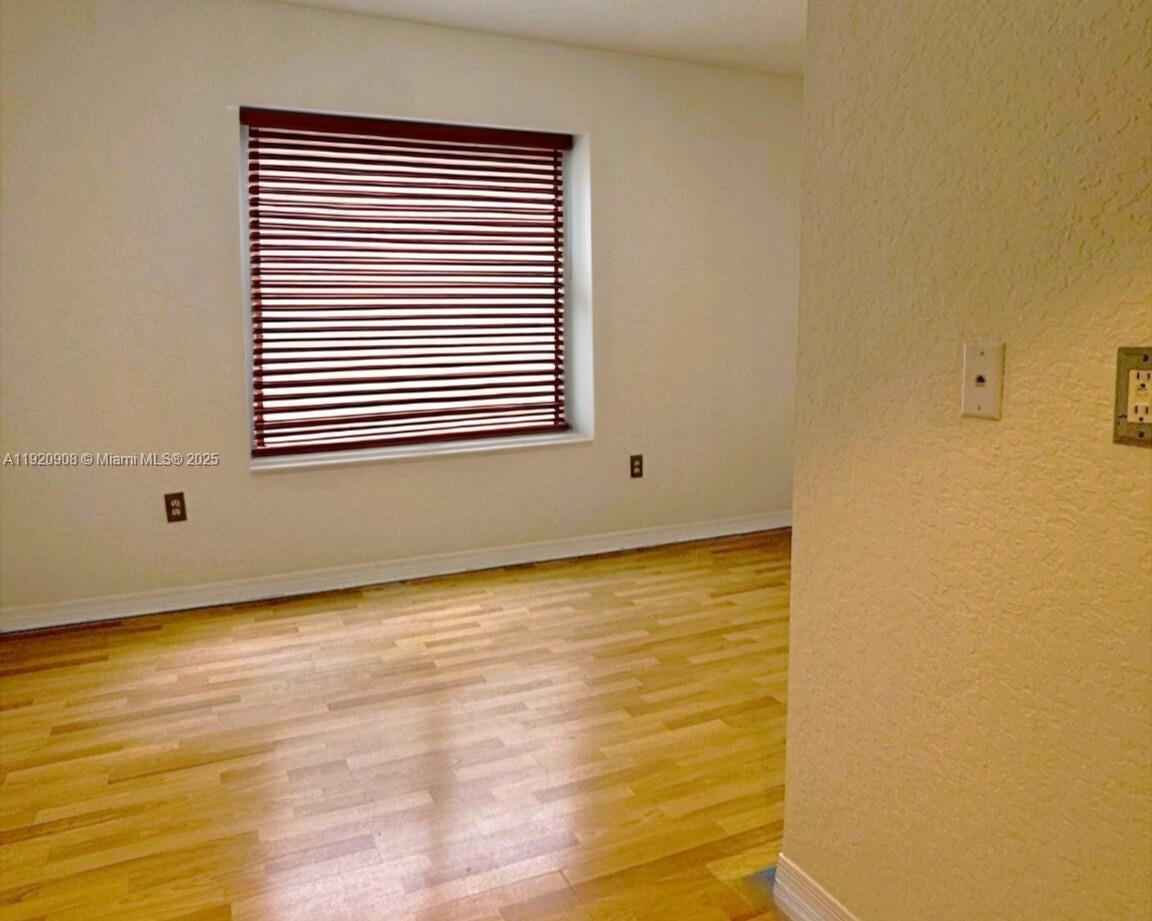 7326 Collins Avenue, Unit 205 Miami Beach, FL 33141 - Photo 7 of 15 a view of an empty room with a window