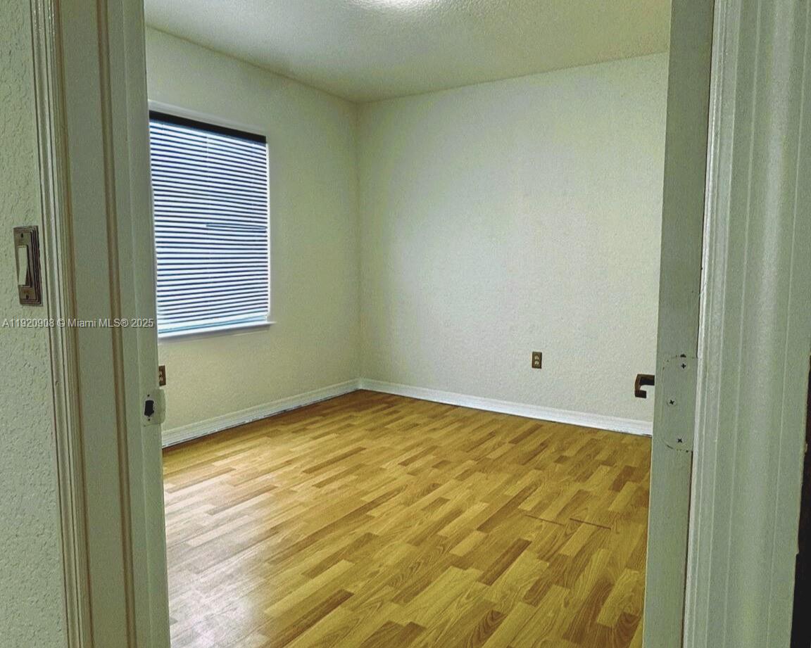 7326 Collins Avenue, Unit 205 Miami Beach, FL 33141 - Photo 8 of 15 a view of an empty room and window