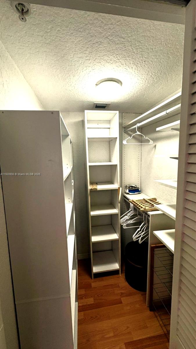 7326 Collins Avenue, Unit 205 Miami Beach, FL 33141 - Photo 10 of 15 a kitchen with a refrigerator and a stove