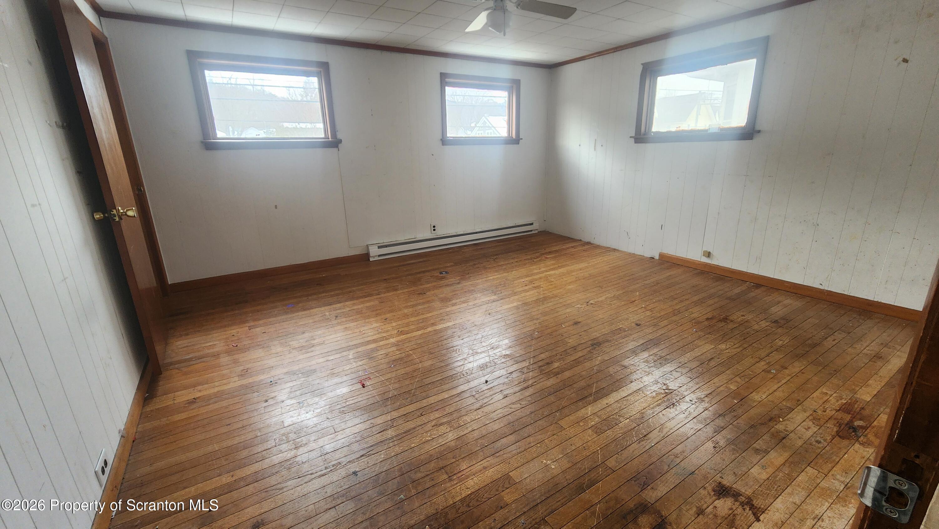 446 Main Street Hallstead, PA 18822 - Photo 17 of 51 a view of empty room with wooden floor and fan