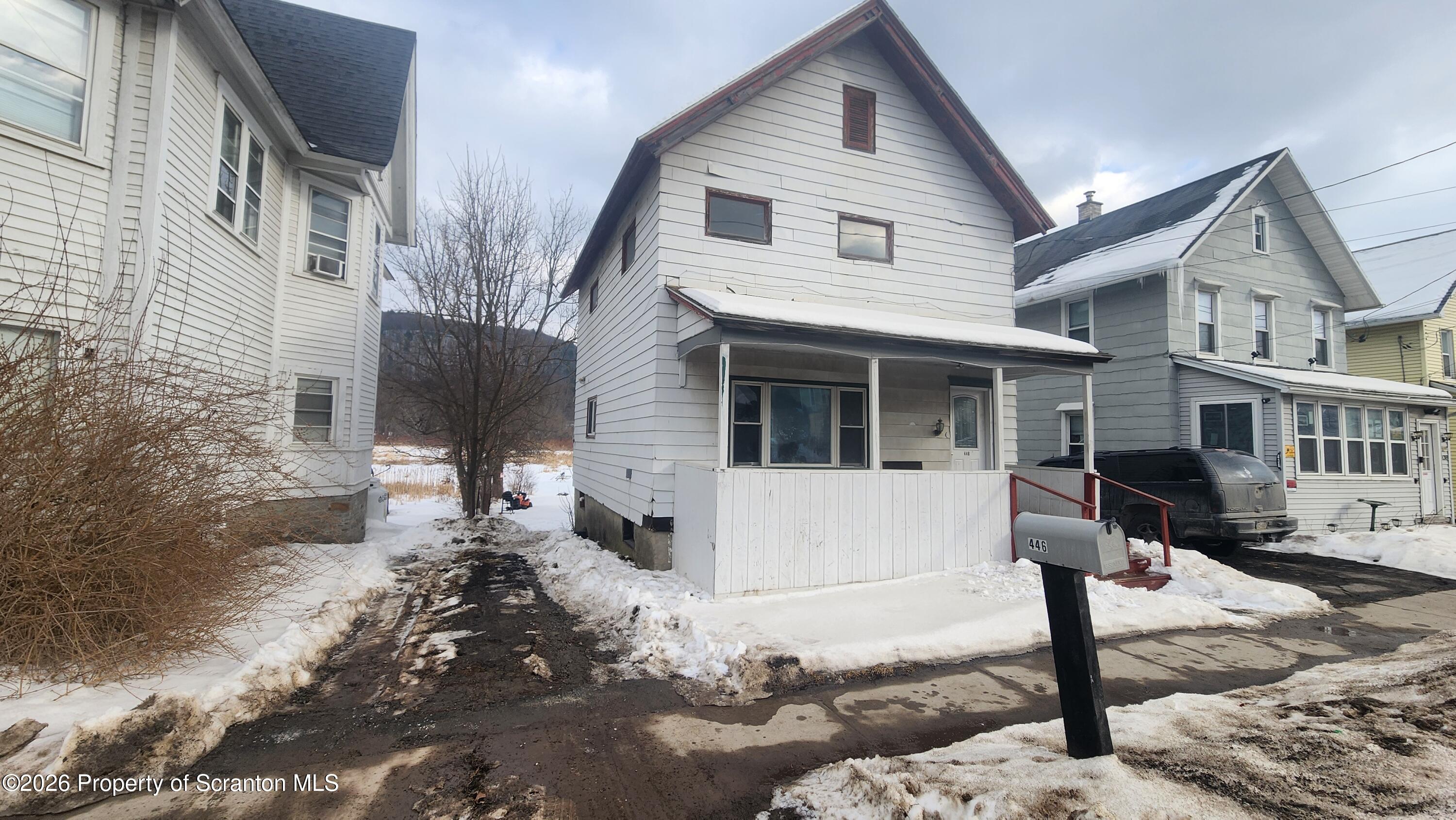 446 Main Street Hallstead, PA 18822 - Photo 50 of 51 a view of a white house next to a road