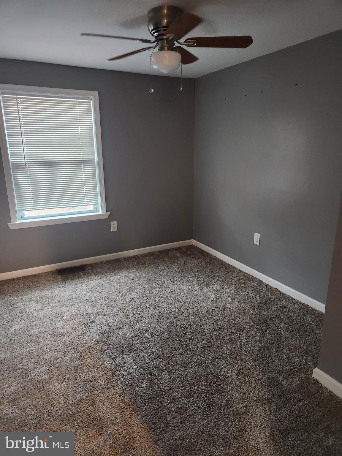 51 Ed Turner Lane, Unit 201 Harpers Ferry, WV 25425 - Photo 5 of 6 en empty room with windows and fan