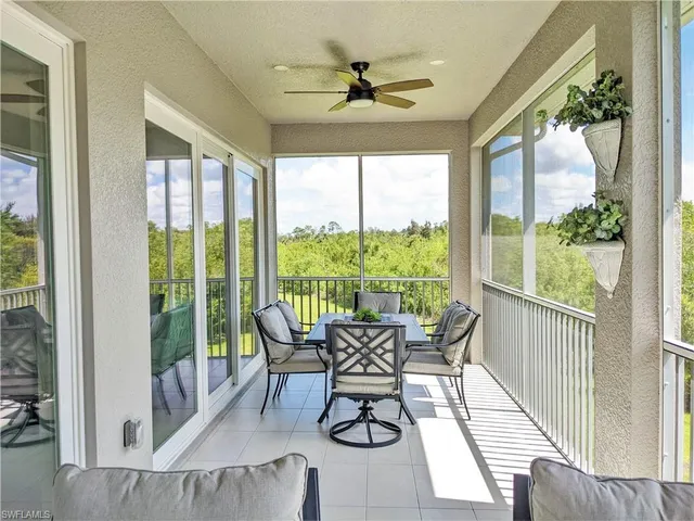 a dining room with furniture window and outside view
