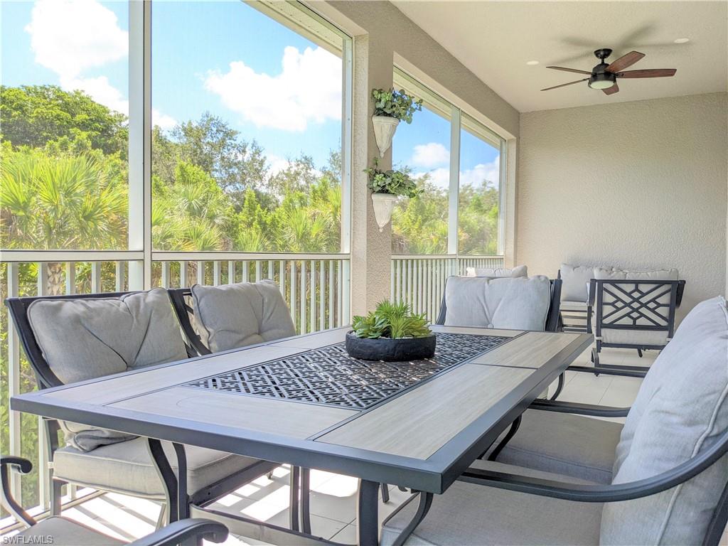 178 Indies Drive East, Unit 201 Naples, FL 34114 - Photo 13 of 31 a view of a dining room with furniture window and outside view