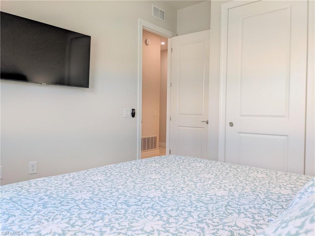 178 Indies Drive East, Unit 201 Naples, FL 34114 - Photo 21 of 31 a view of a livingroom with an empty space