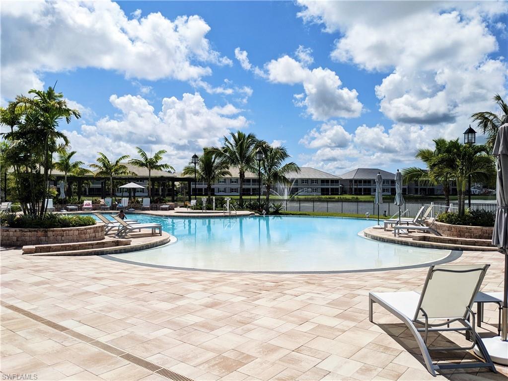 178 Indies Drive East, Unit 201 Naples, FL 34114 - Photo 25 of 31 a view of swimming pool with seating space and barbeque oven