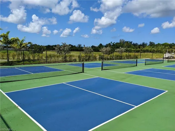 a view of an outdoor space and tennis court