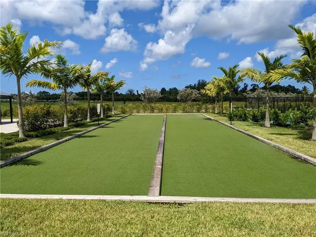 a view of a swimming pool and a yard