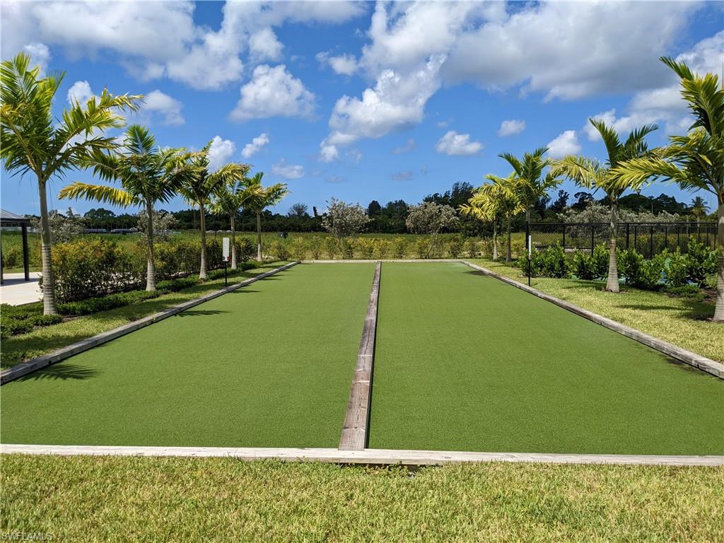178 Indies Drive East, Unit 201 Naples, FL 34114 - Photo 30 of 31 a view of a swimming pool and a yard
