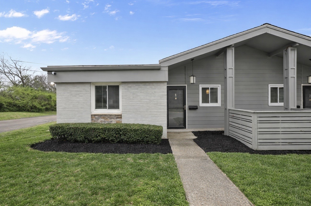 1900 Richard Jones Road, Unit K1 Nashville, TN 37215 - Photo 1 of 26 a front view of a house with a yard