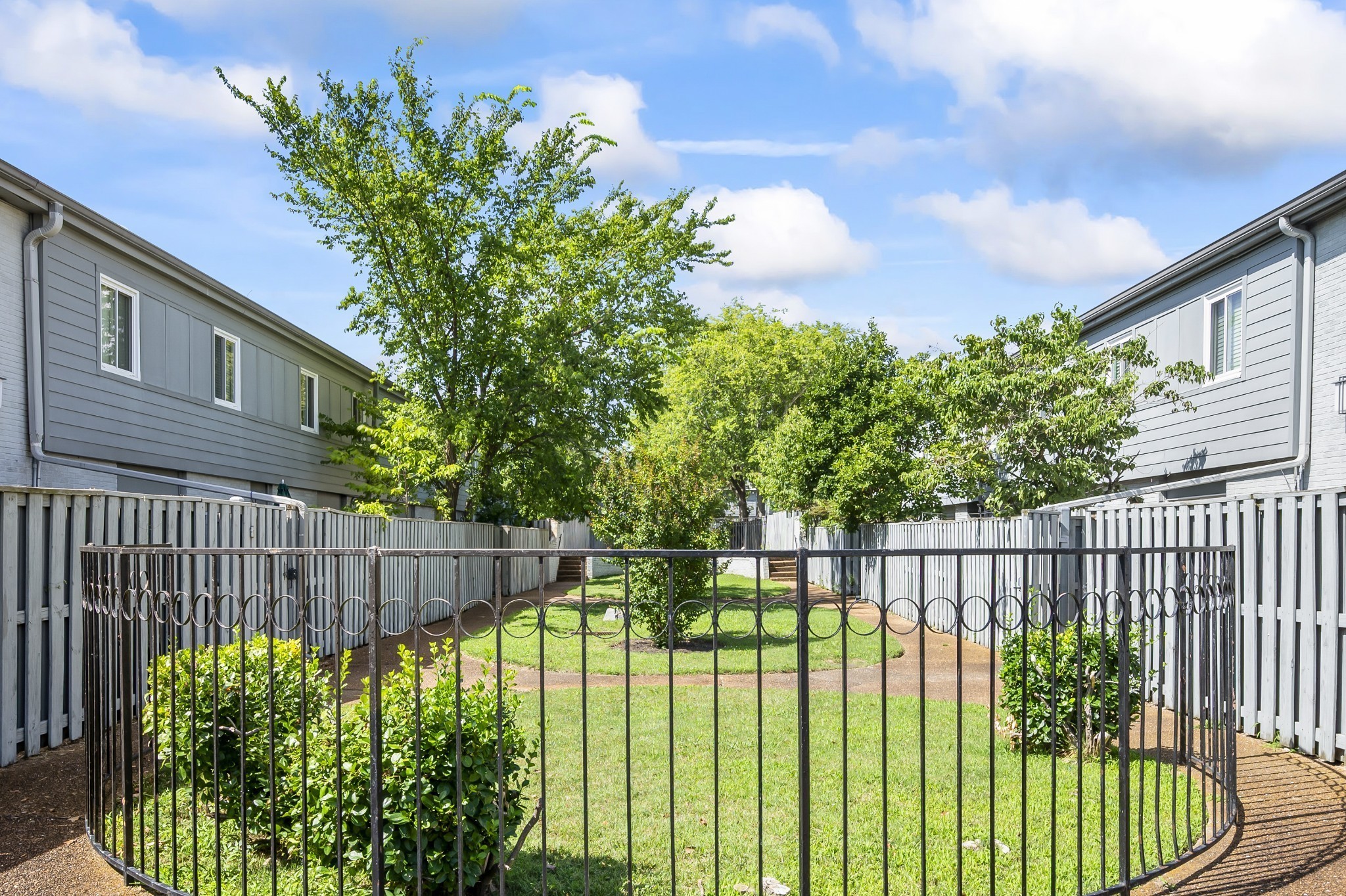 1900 Richard Jones Road, Unit K1 Nashville, TN 37215 - Photo 18 of 26 a view of a fence in the back yard