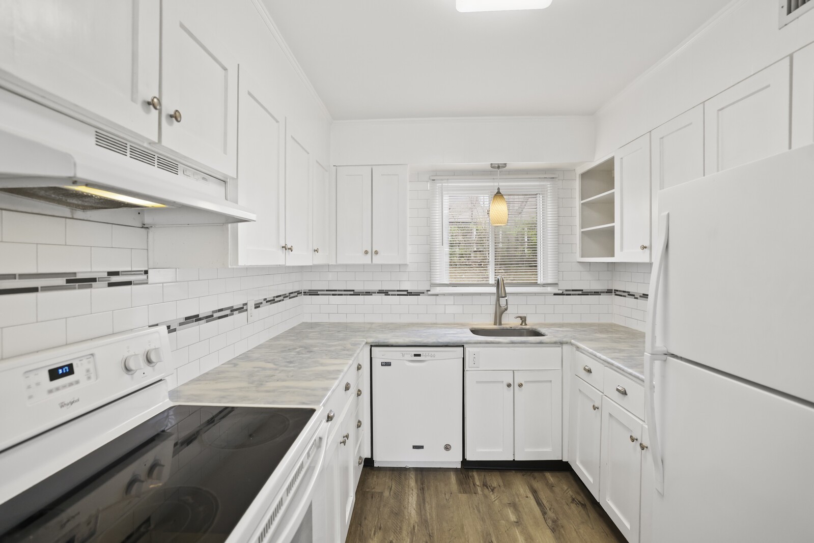 1900 Richard Jones Road, Unit K1 Nashville, TN 37215 - Photo 5 of 26 a kitchen with granite countertop white cabinets and white appliances