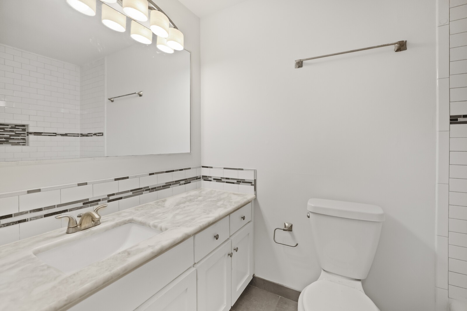 1900 Richard Jones Road, Unit K1 Nashville, TN 37215 - Photo 7 of 26 a bathroom with a granite countertop sink a toilet and a mirror