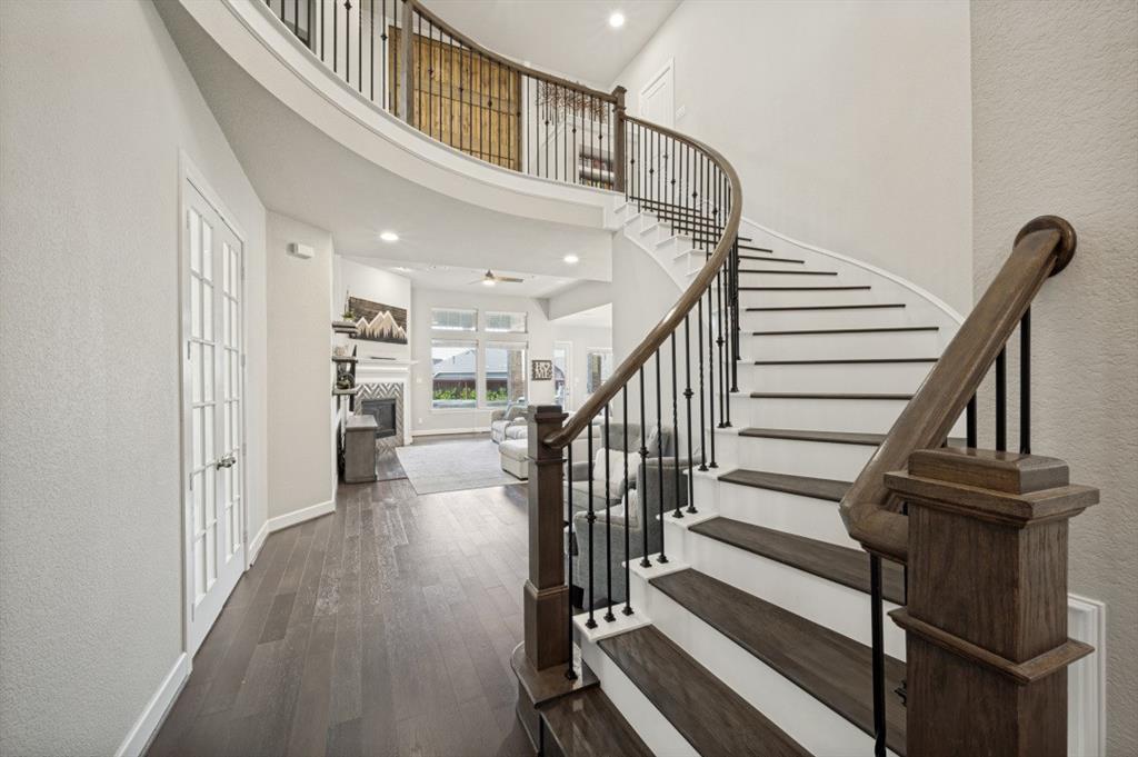 2721 Old Shire Path Road Prosper, TX 75078 - Photo 2 of 39 Two-story foyer featuring a curved staircase