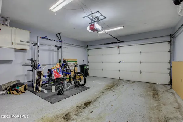 a view of a garage with a lot of stuff