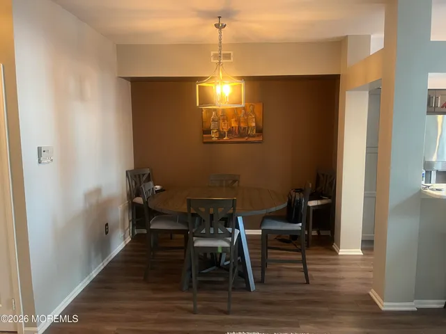 a kitchen with stainless steel appliances granite countertop a refrigerator stove and sink