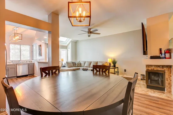 a dining room with furniture and window