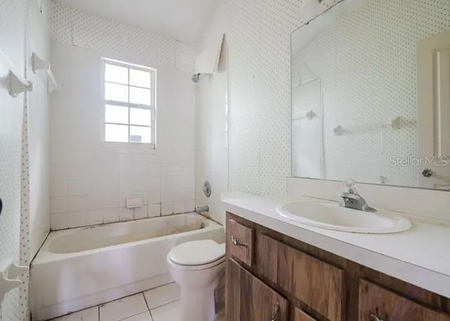 a bathroom with a toilet and a sink