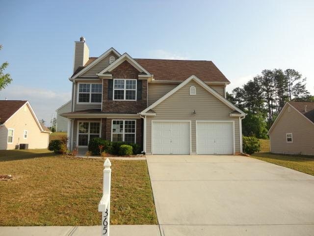 365 Stone Ridge Way, Unit 77 Covington, GA 30016 - Photo 1 of 1 a view of a house with a yard