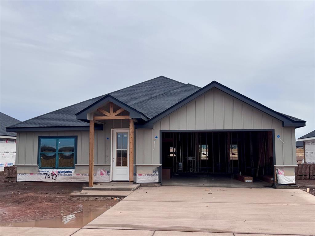 7693 Lake Ridge Parkway Abilene, TX 79602 - Photo 2 of 2 a view of a house with large windows and a yard