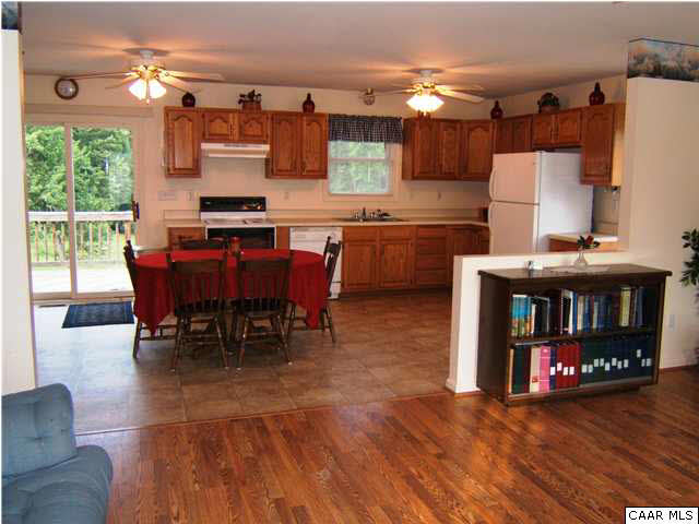 274 Good Hope Church Road Aroda, VA 22709 - Photo 14 of 23 a kitchen with stainless steel appliances a dining table chairs and granite counter tops