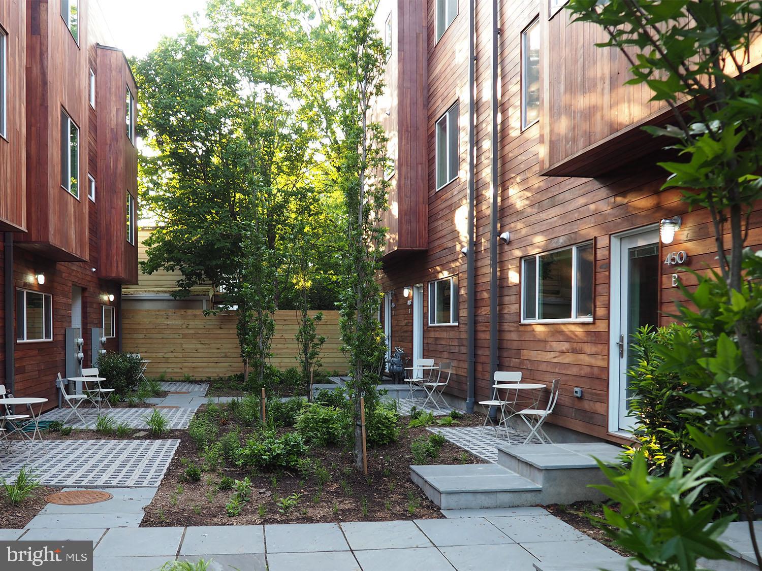 446 Ridge Street Northwest Washington, DC 20001 - Photo 19 of 24 a view of a patio with table and chairs and potted plants