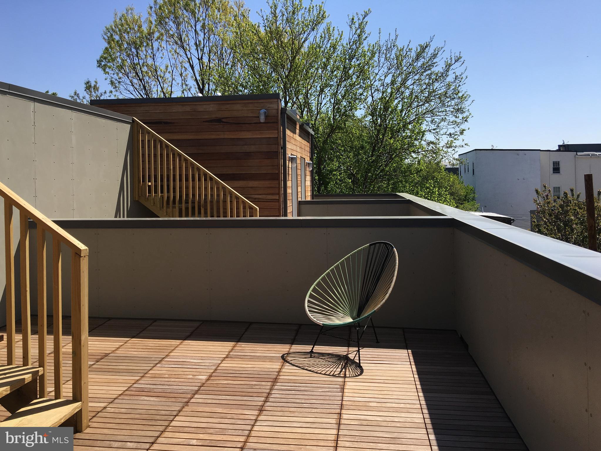 446 Ridge Street Northwest Washington, DC 20001 - Photo 20 of 24 a couple of chairs sitting on a roof deck