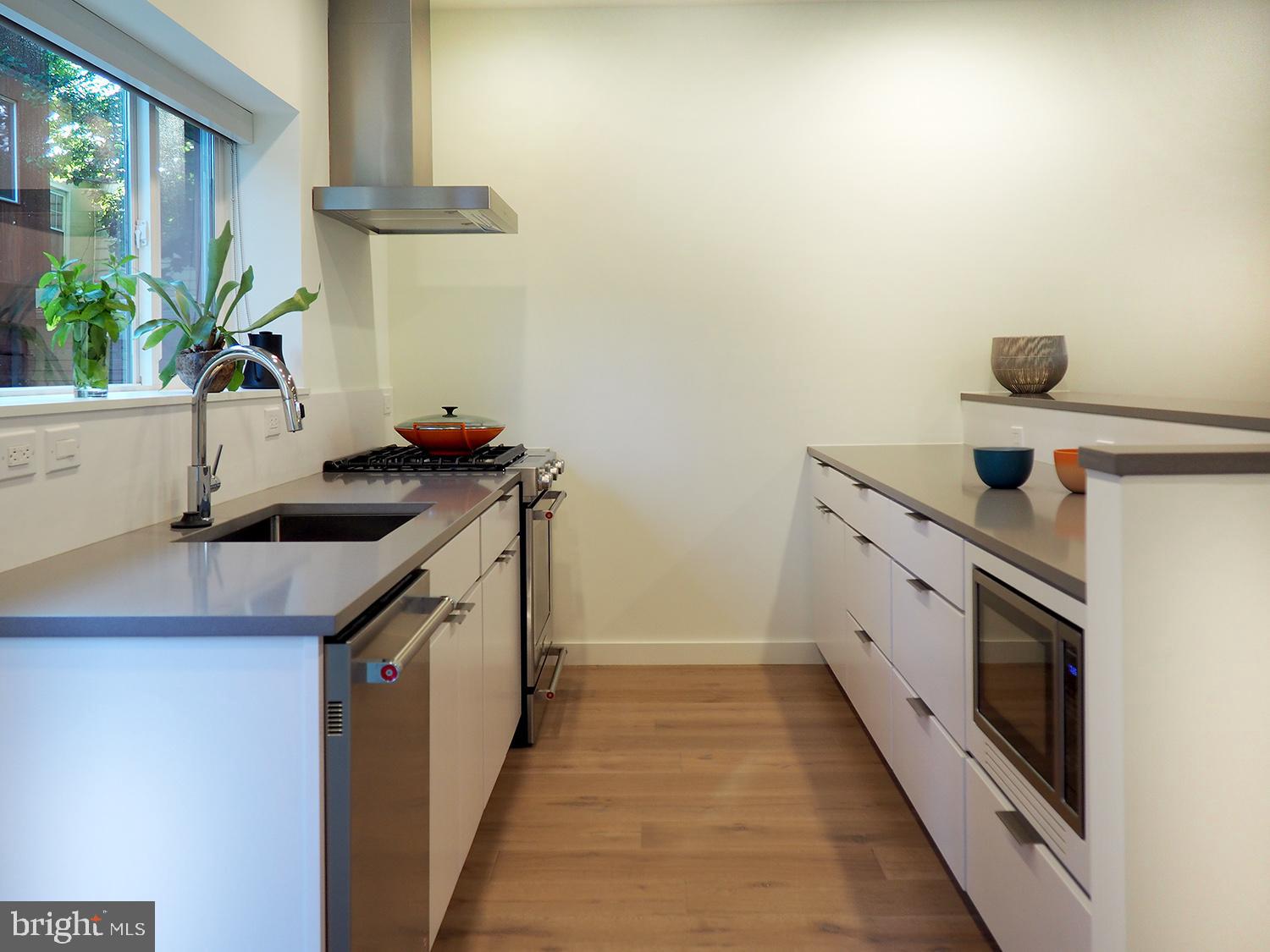 446 Ridge Street Northwest Washington, DC 20001 - Photo 22 of 24 a kitchen with stainless steel appliances a sink and a stove