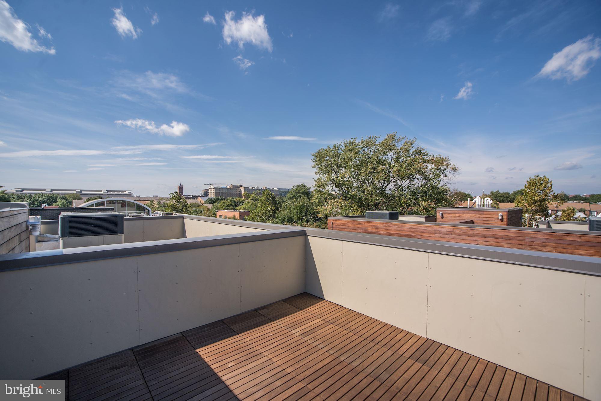 446 Ridge Street Northwest Washington, DC 20001 - Photo 4 of 24 a view of a balcony with city view