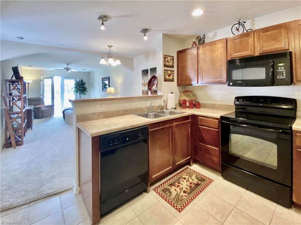 4505 Old Battleground Road Greensboro, NC 27410 - Photo 3 of 19 Kitchen w/black appliances