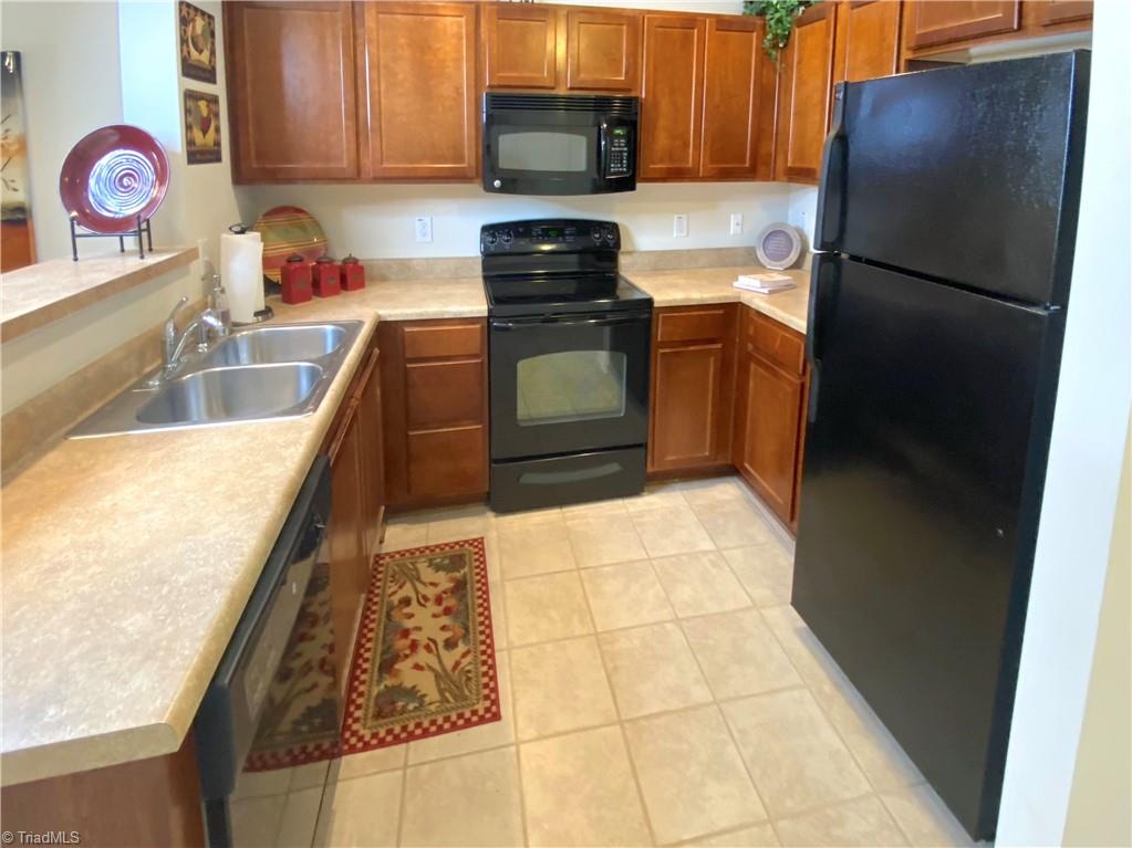 4505 Old Battleground Road Greensboro, NC 27410 - Photo 5 of 19 tile flooring in kitchen