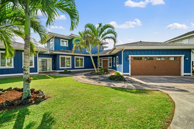 a view of a house with swimming pool and yard