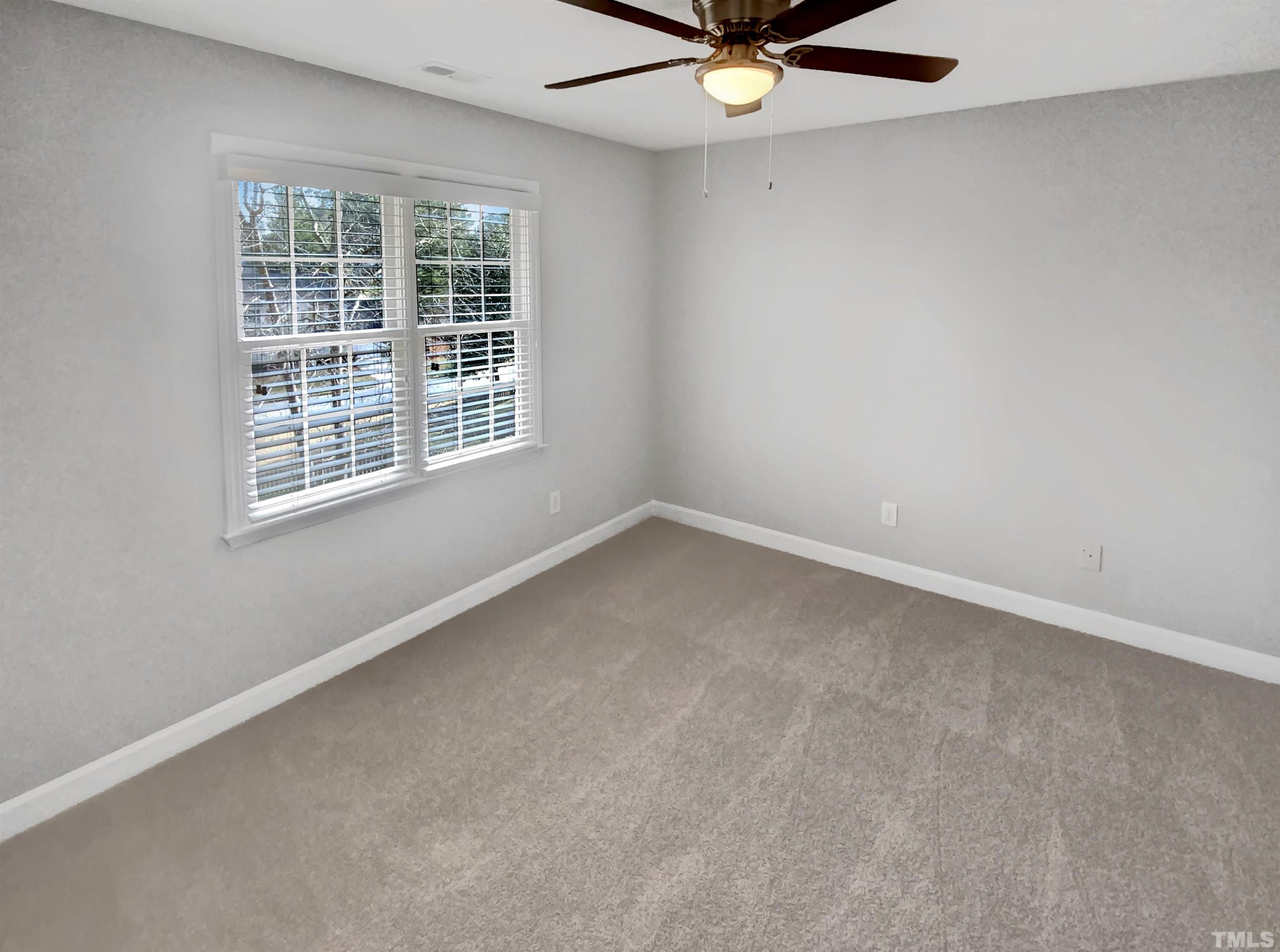 3216 Leebrook Road Raleigh, NC 27616 - Photo 14 of 17 an empty room with a window