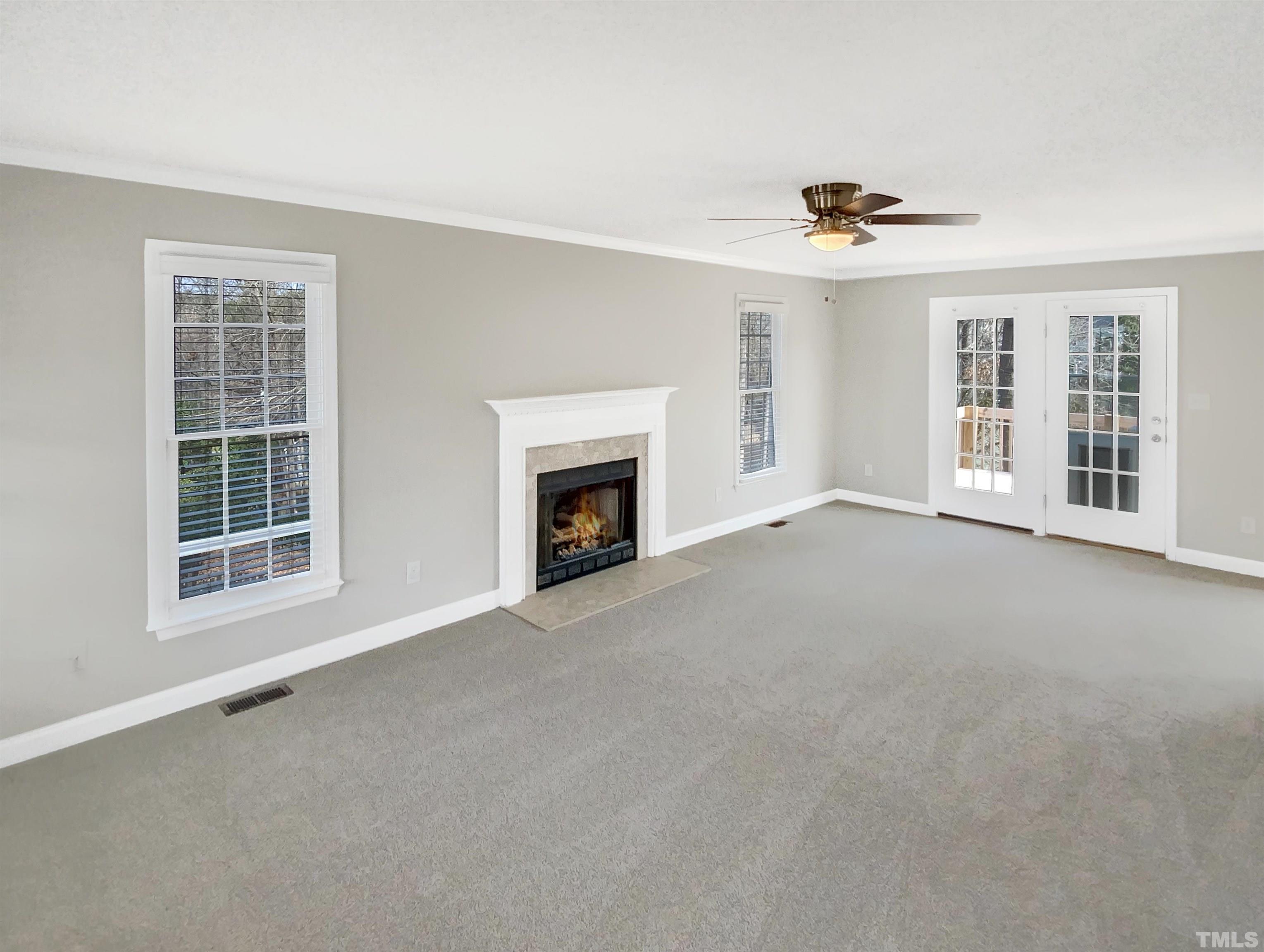 3216 Leebrook Road Raleigh, NC 27616 - Photo 4 of 17 a view of an empty room with a fireplace